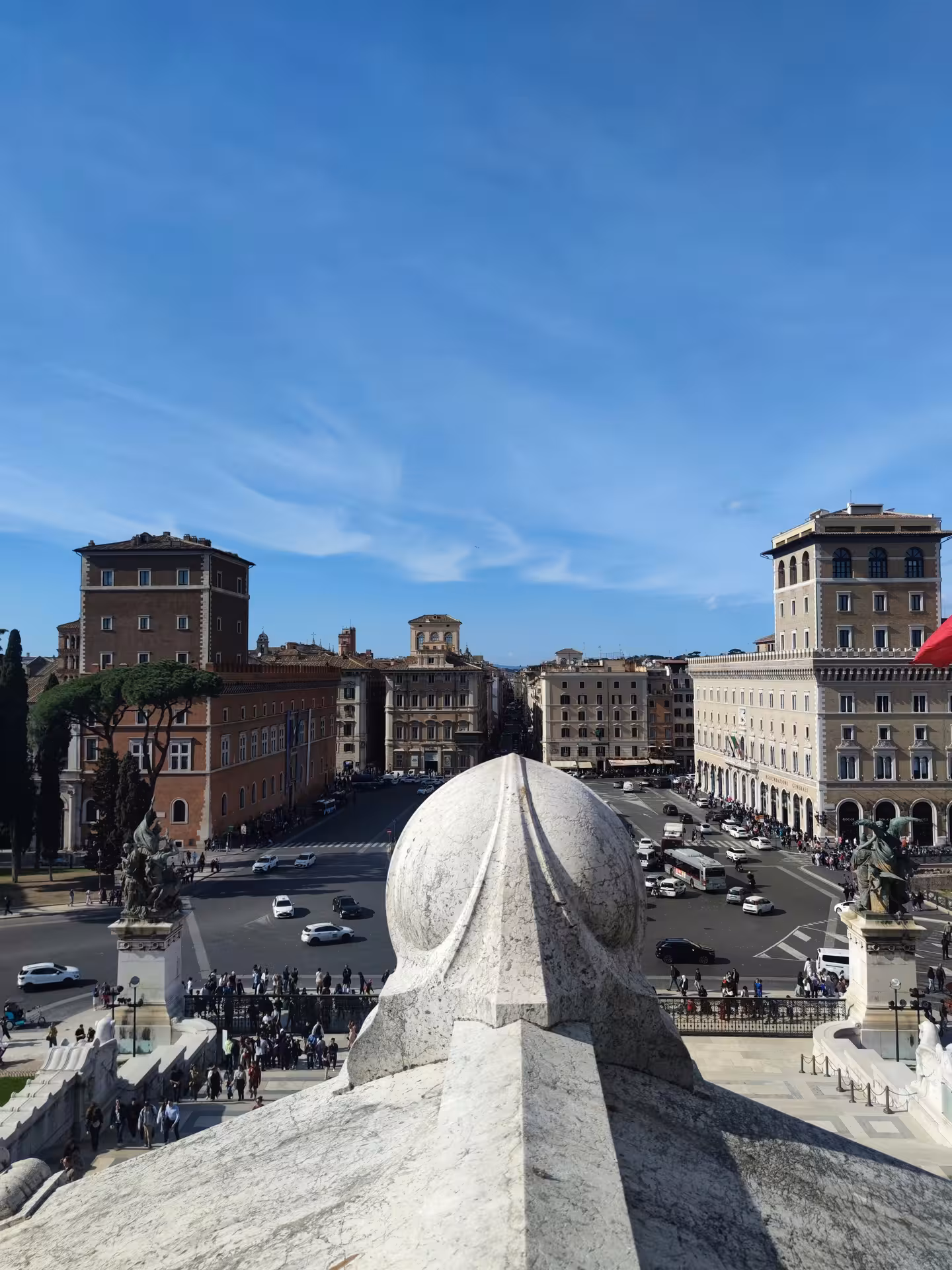 Panoramic view from Sant'Angelo Castle showcasing Rome's historic architecture and bustling city life.