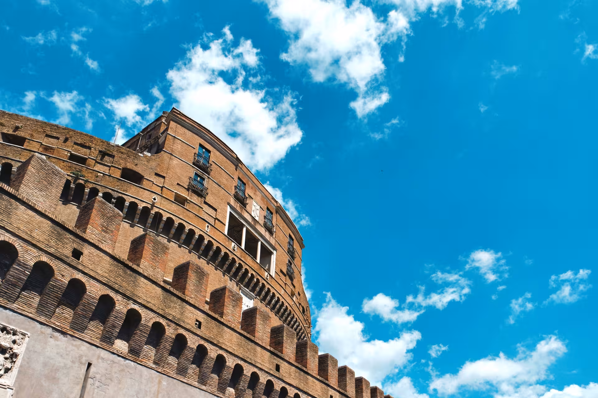 View of Sant'Angelo Castle against a vibrant blue sky, perfect for Rome's historical combo tour experience.