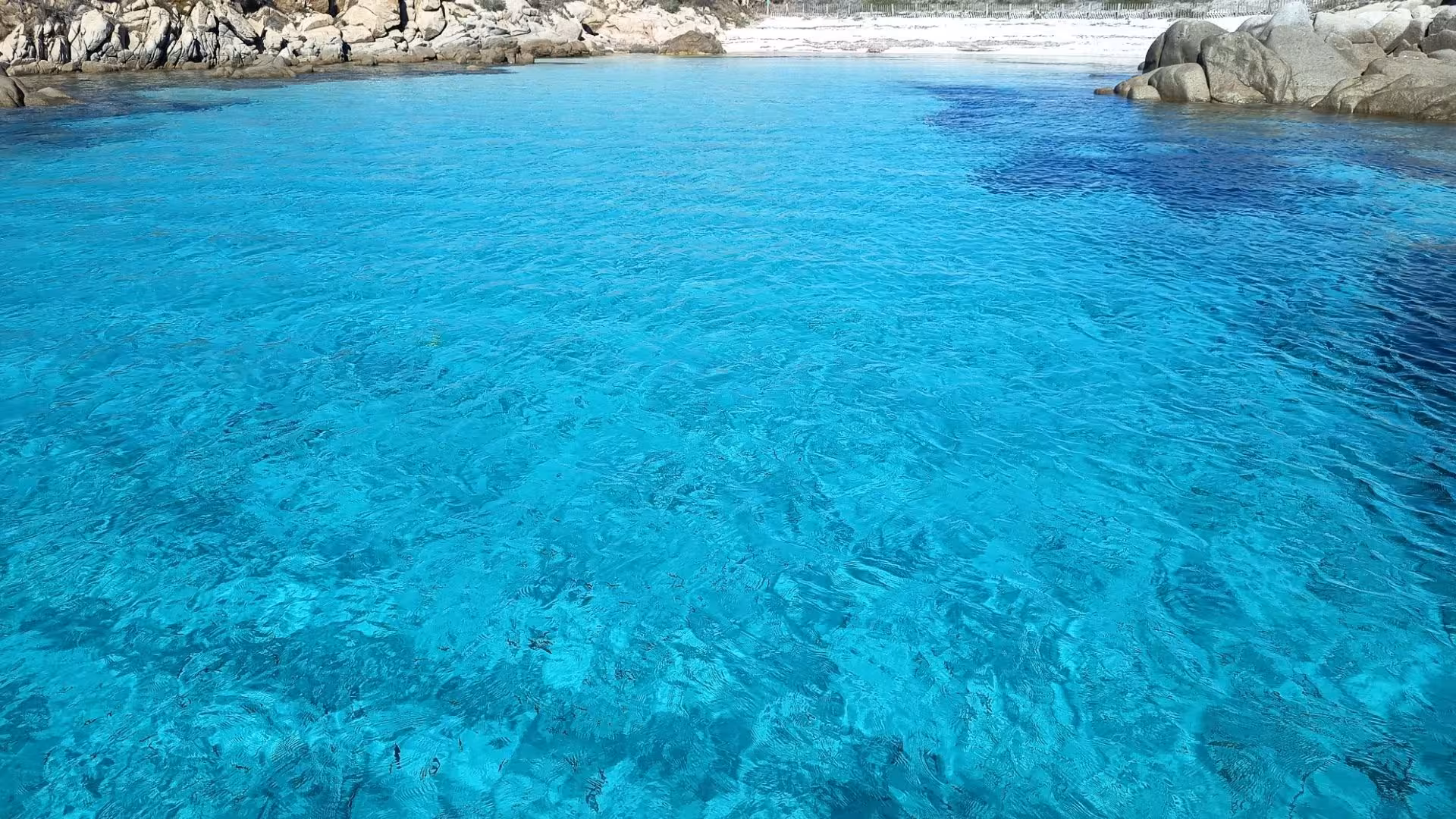 Crystal clear turquoise waters near Santa Teresa di Gallura, perfect for a sailing tour to southern Corsica.
