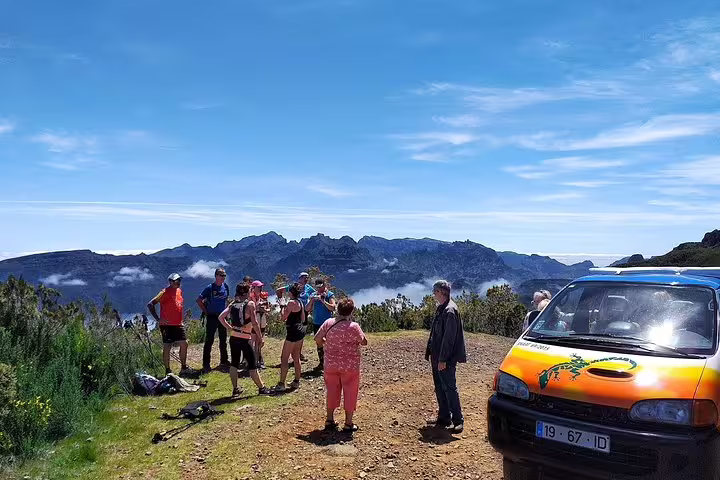 Group enjoying panoramic mountain views during Santana Wonders and Northeast 4WD Experience in Madeira under clear blue skies.
