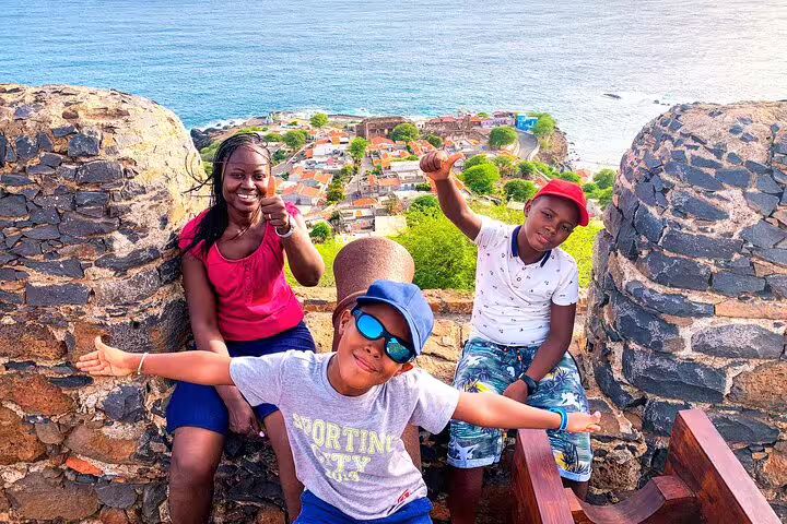 Family at Cidade Velha viewpoint on Santiago Island, Cape Verde, during Calabaceira Valley guided hike