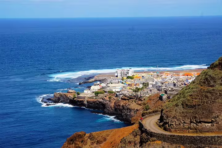 Charming coastal village nestled on rocky shores with expansive ocean views on the Ponta do Sol hiking route.