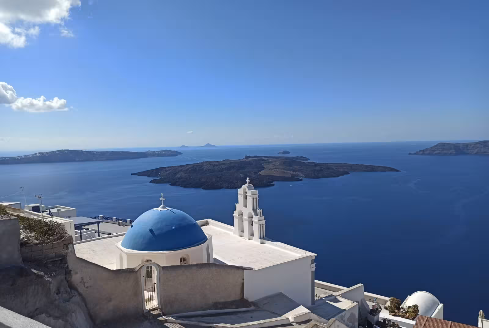 Blue-domed church and Santorini caldera panorama, iconic photo stop on Shore to Oia 5-hour cruise guest tour