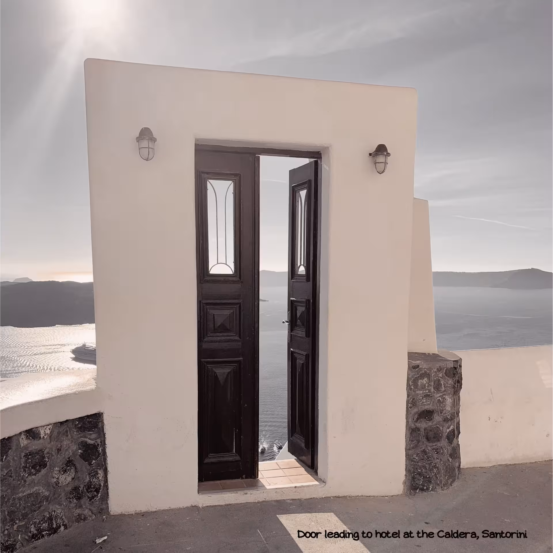 Open door on Santorini caldera cliff, iconic Cyclades view on Athens island hopping tour to Mykonos and Naxos
