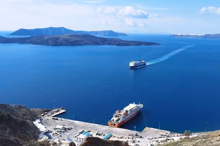 Santorini caldera panorama with cruise ships near Athinios port, featured on a private 3-day tour transfer