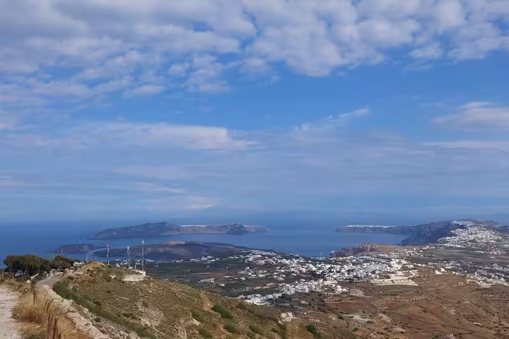 Panoramic Santorini caldera view from hilltop, perfect for a private 3-day tour with transfers included