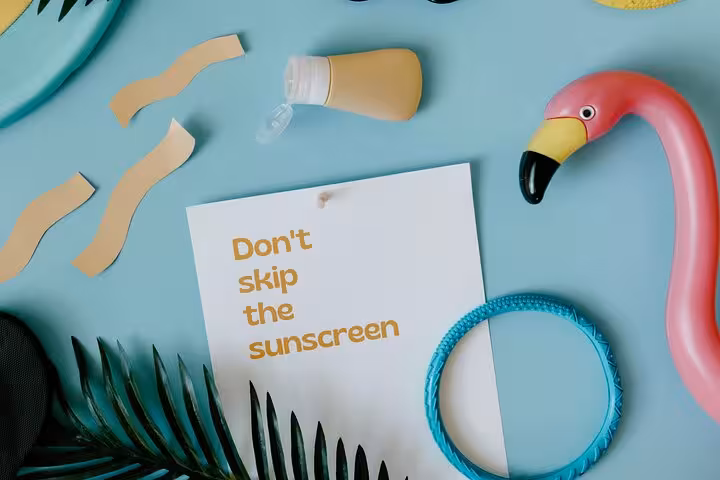 Sunscreen reminder with pool accessories for a Santorini private pool day, caldera views and sunset experience