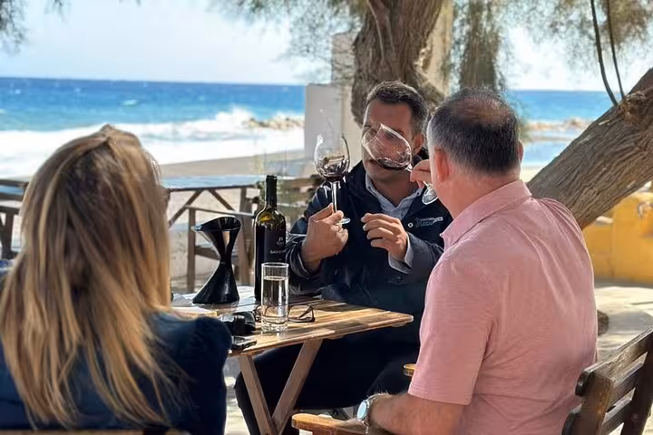 Sommelier-led wine tasting by the sea in Santorini on a private winery tour with lunch and local varietals