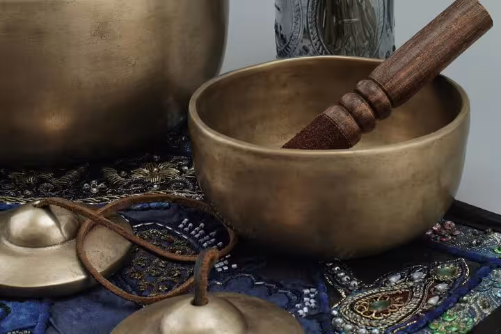 Tibetan singing bowls and chimes for Santorini Serenity yoga meditation, calming sound healing by the caldera