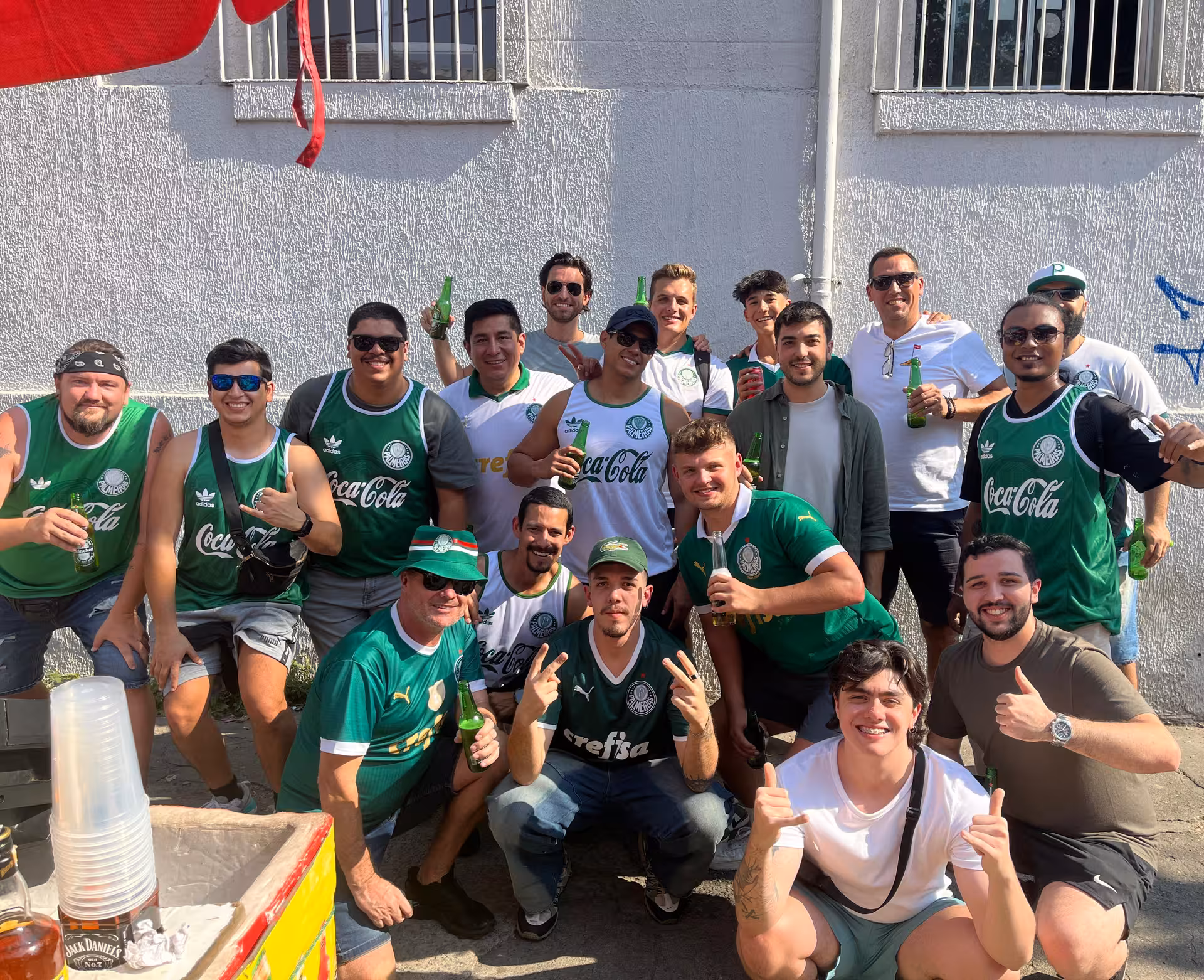 Group of local fans in São Paulo before a soccer game, meeting travelers for an authentic matchday experience