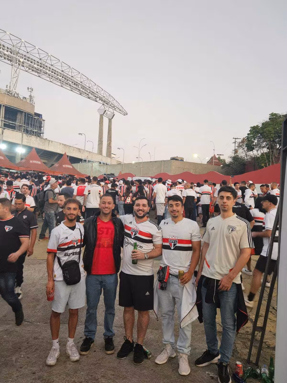 Travelers meet local fans outside Morumbi Stadium before a São Paulo soccer game meetup and kickoff