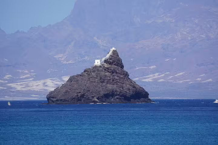 Ilhéu dos Pássaros islet off São Vicente seen from the sea, a scenic highlight on Calhau transfer
