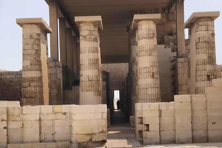 Ancient limestone columns at Saqqara temple complex on private all-inclusive Dahshur Pyramids, Memphis day tour