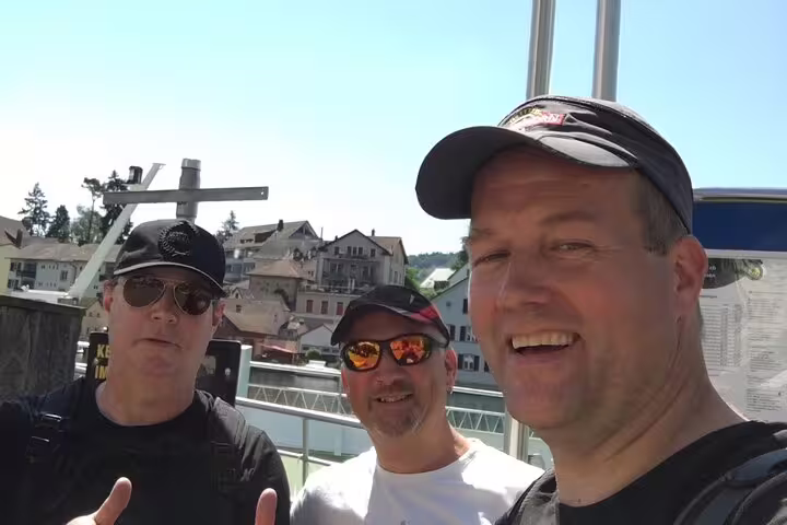 Three travelers selfie near the Rhine in Schaffhausen on a self-guided scavenger hunt and walking sights tour