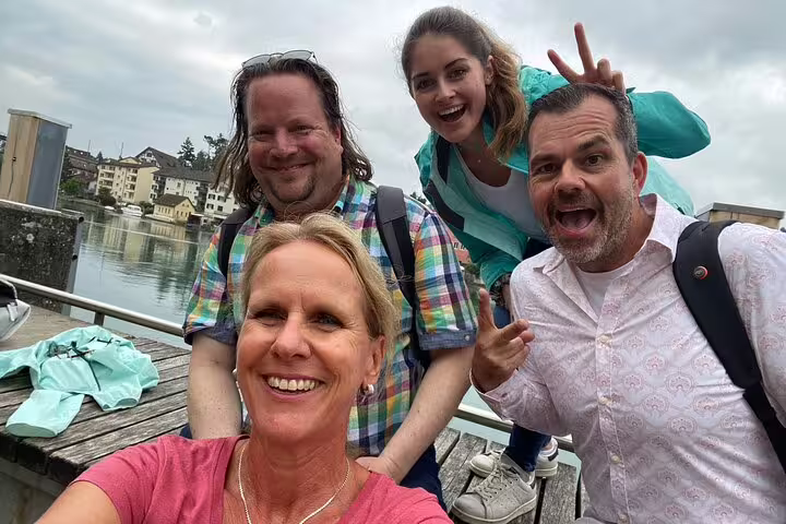 Happy group selfie on a riverside dock in Schaffhausen, enjoying a self-guided scavenger hunt city highlights tour