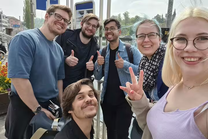 Happy travelers at a Schaffhausen stop on a self-guided scavenger hunt and sights tour, posing for a selfie