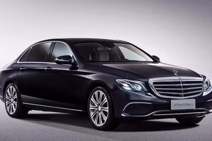 Luxury black sedan for Schiphol Airport to Rotterdam private transfer with professional chauffeur service