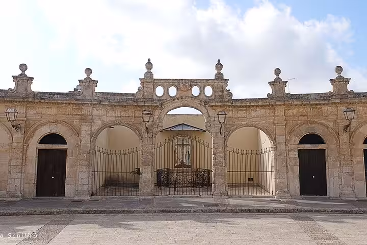 Elegant stone architecture of the Scicli Town Hall, featured in the Il Commissario Montalbano TV series tours.