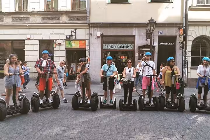 Tourists on Segways in Krakow's Kazimierz area, capturing the lively essence of the Jewish Quarter.