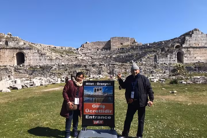 Private guided Seven Churches of Revelation tour at Miletus ruins, travelers at ancient theater entrance