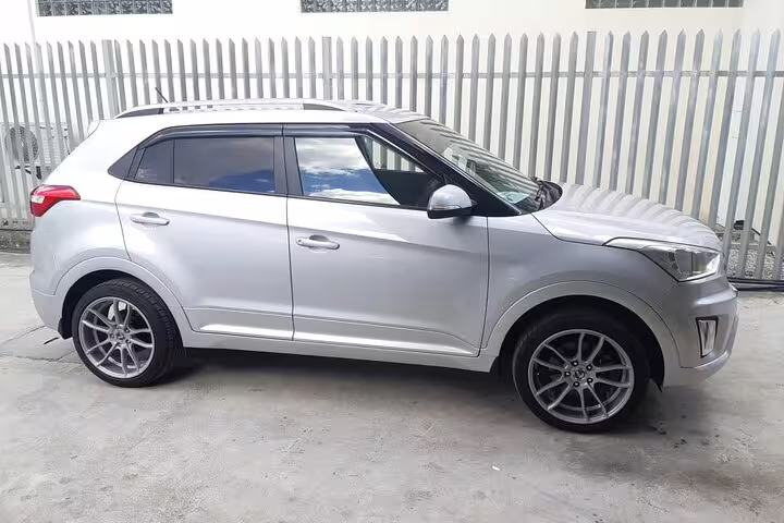 Sleek silver SUV ideal for comfortable Seychelles hotel transfers, offering reliable and stylish airport pickup service.