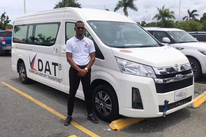 Professional driver beside white van for Sharm El Sheikh Airport private transfer service with meet and greet