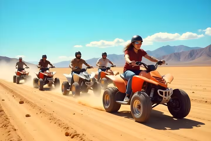 Group ATV desert safari from Sharm El Sheikh riding across sand dunes, adventure tour with BBQ dinner show