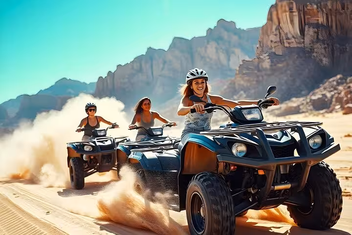 Quad biking in Sharm El Sheikh desert with mountains, part of ATV safari with BBQ dinner and show