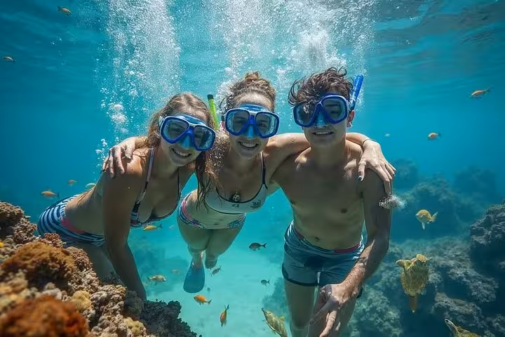 Snorkelers in crystal-clear Blue Hole waters near Dahab, a highlight of the Sharm El-Sheikh jeep tour