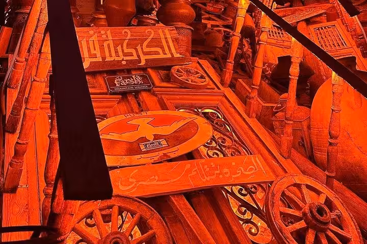 Decorated wooden staircase with Arabic signs at Sharm El-Sheikh cafe, ideal for shisha and drink experience