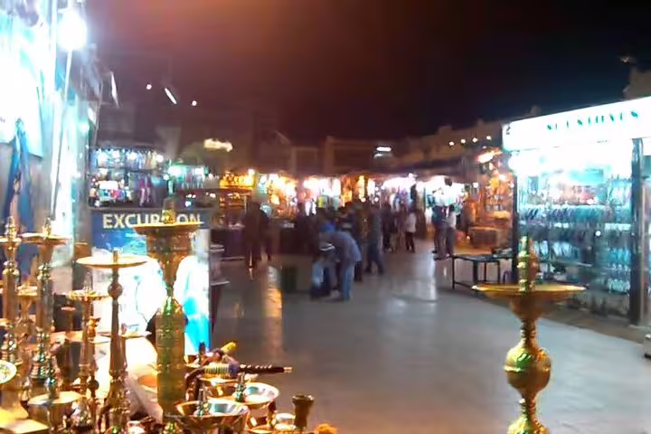 Nighttime Sharm El Sheikh Old Market street with brass hookahs and shops on VIP city sightseeing tour