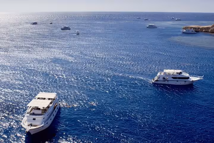 Boats cruising the Red Sea near Ras Mohamed National Park, Sharm El-Sheikh White Island snorkeling tour