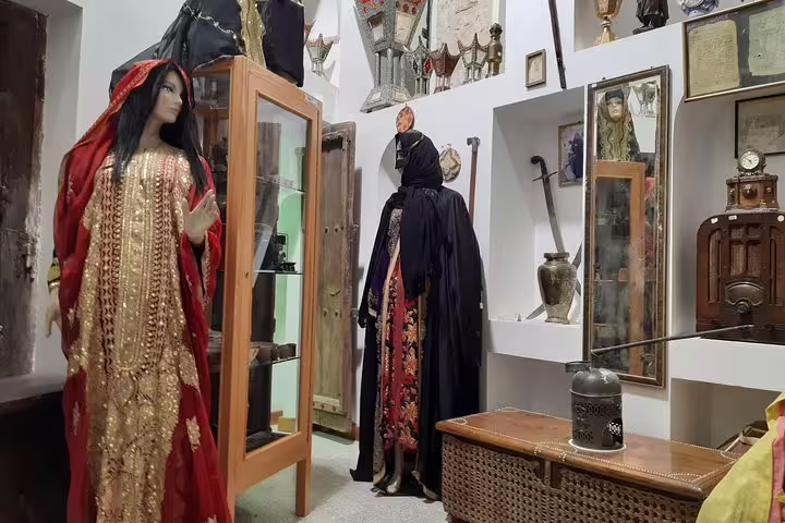 Explore traditional clothing displays at Sheikh Faisal Museum, showcasing rich Arabian heritage and culture.