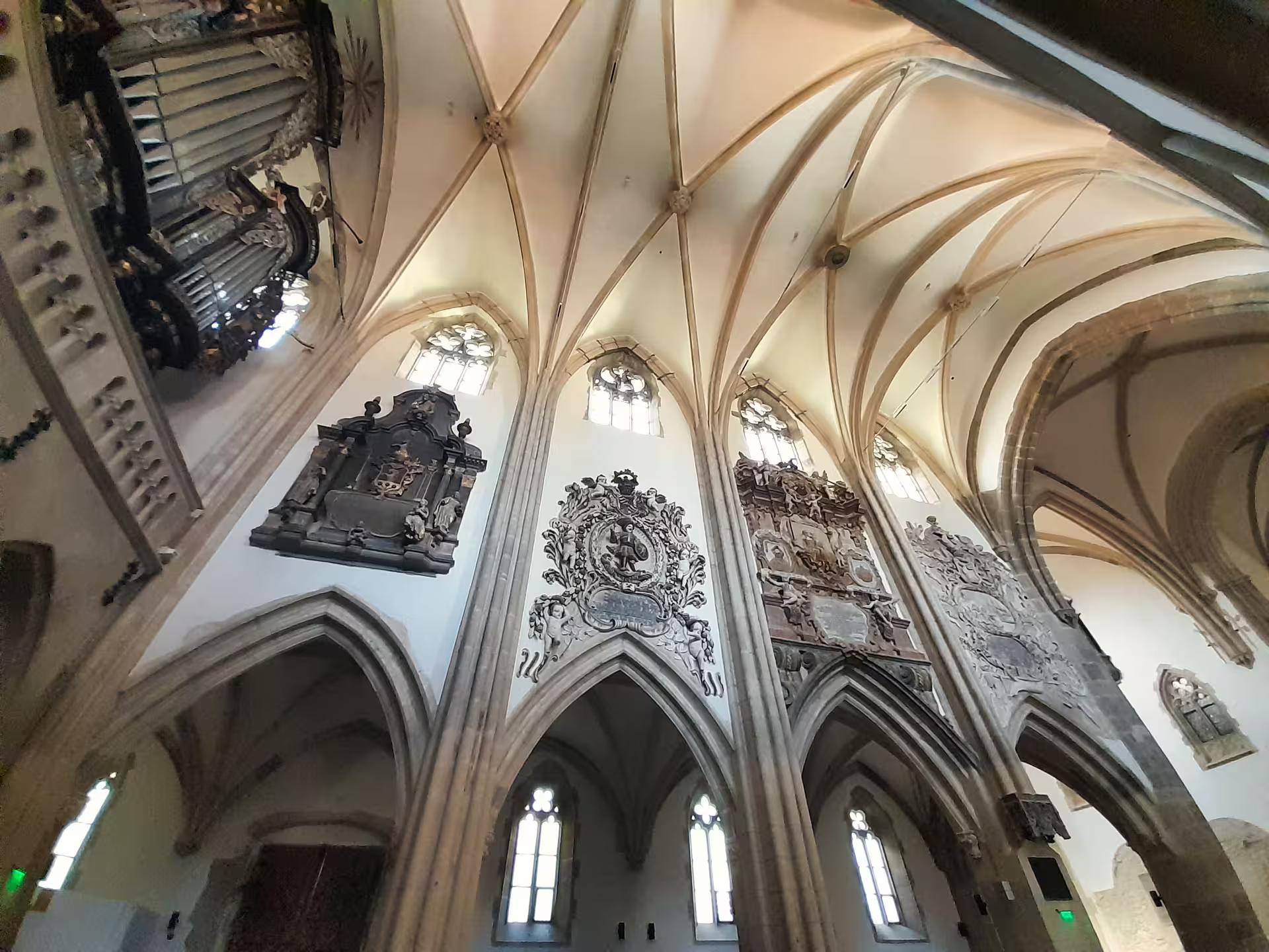 Stunning Gothic vaulted ceiling and baroque epitaphs inside Sibiu Cathedral on Transylvania castle tour