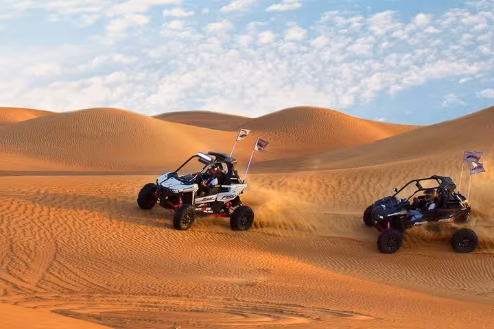 Private dune buggy adventure from Sharm El Sheikh racing across Sinai Desert sand dunes at sunset