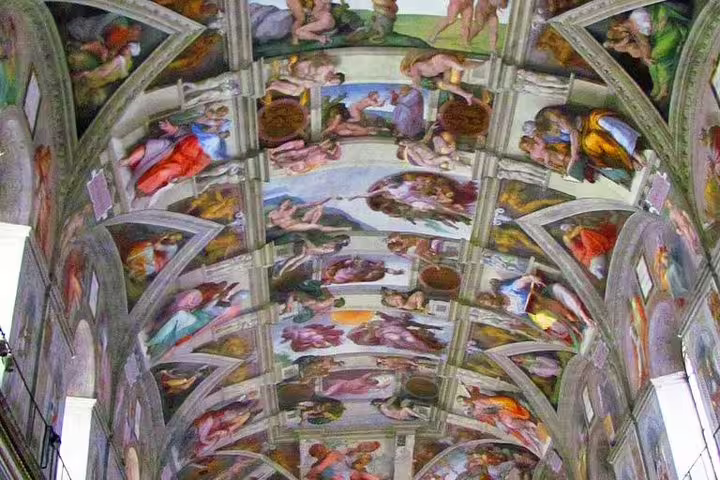 Panoramic view of the Sistine Chapel ceiling frescoes, a highlight of Vatican Museums fast track guided group tours