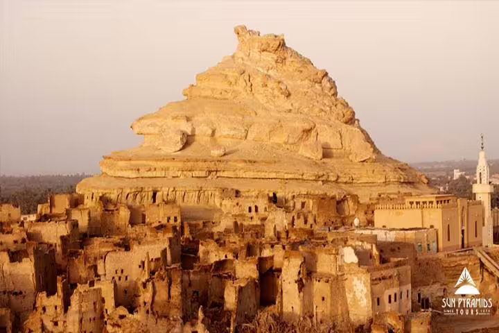 Panoramic view of Siwa Oasis old town and Shali Fortress hill at sunset, 5 days 4 nights package