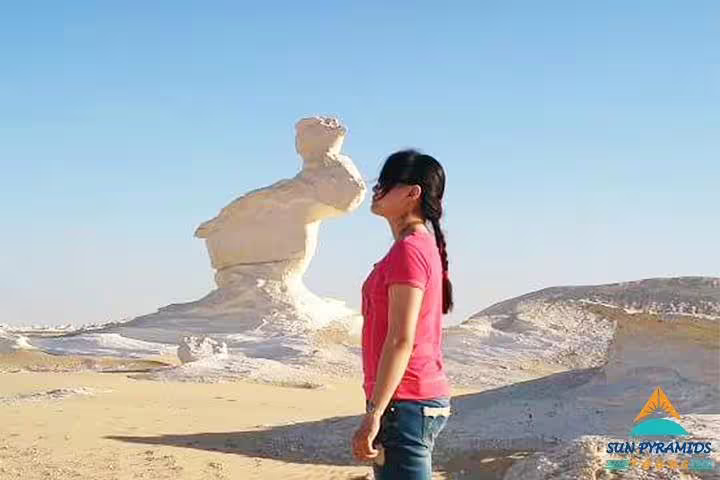 Traveler at the White Desert rock formations near Siwa Oasis, Egypt, 5 days 4 nights short break tour