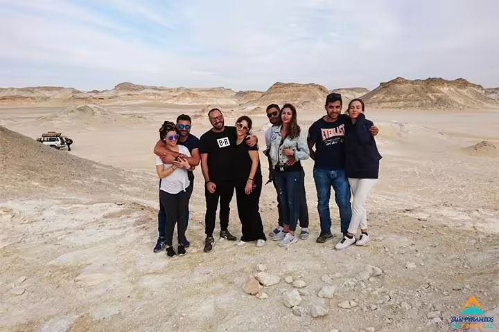 Group photo in Egypt’s White Desert on Siwa Oasis short break package, 5 days 4 nights desert safari