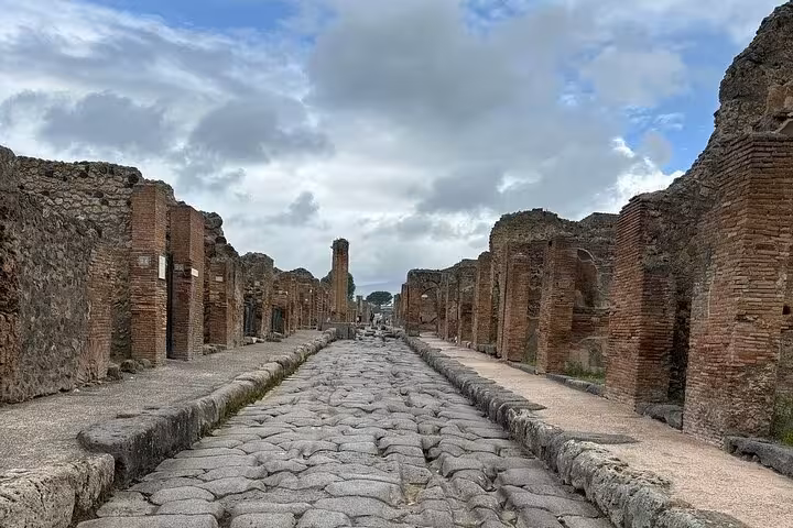 Explore ancient stone streets of Pompeii on a guided tour, bypassing lines for an immersive historical experience.