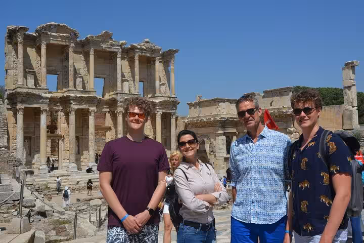 Cruise guests pose by the Library of Celsus on a skip-the-line private Ephesus tour from Kusadasi port