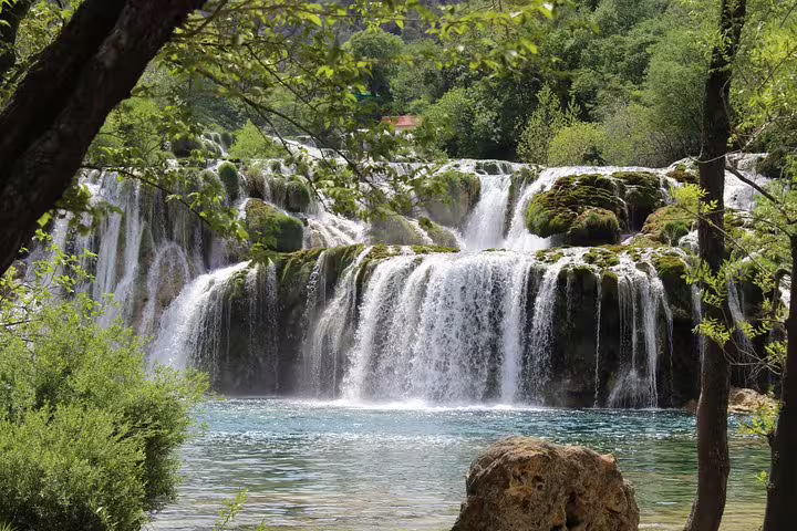 Skradinski Buk waterfall cascades into turquoise pools, Krka National Park waterfalls tour in Croatia