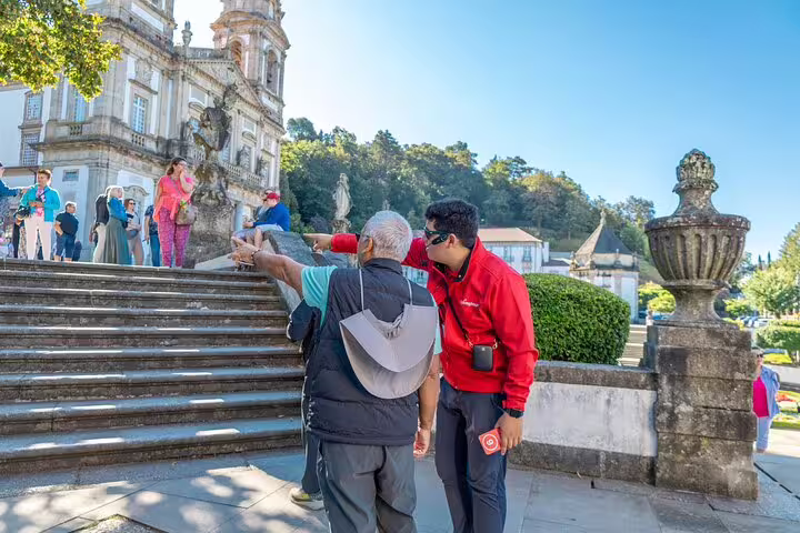 Guide leads a small group up the steps of Bom Jesus do Monte in Braga, highlighting its rich history.