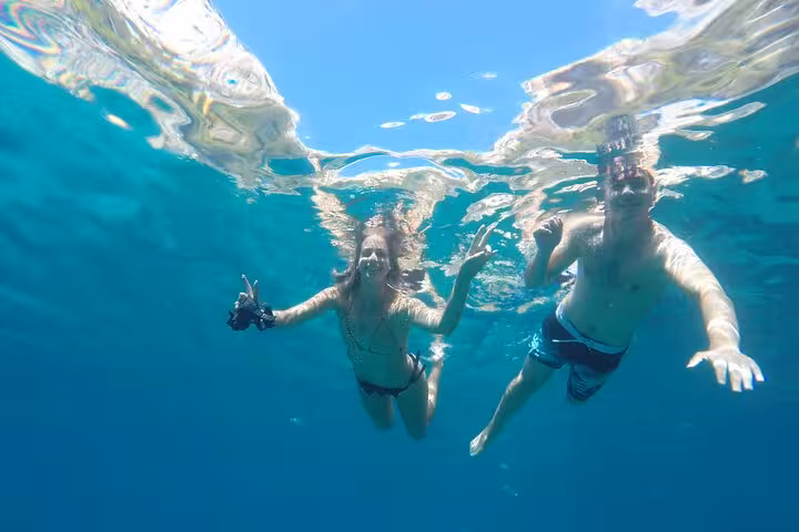 Snorkeling in clear waters of Calanques National Park near Marseille, sea swim stop on guided hiking tour