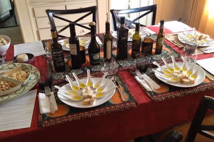 Elegant table set for an Italian olive oil tasting experience on the Sorrento, Pompei & Wine-Tasting 8-hour tour.