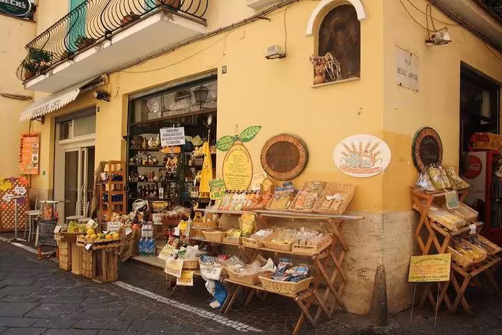 Charming Sorrento shopfront displaying local goods, perfect for exploring on the Sorrento, Pompei & Wine-Tasting tour.