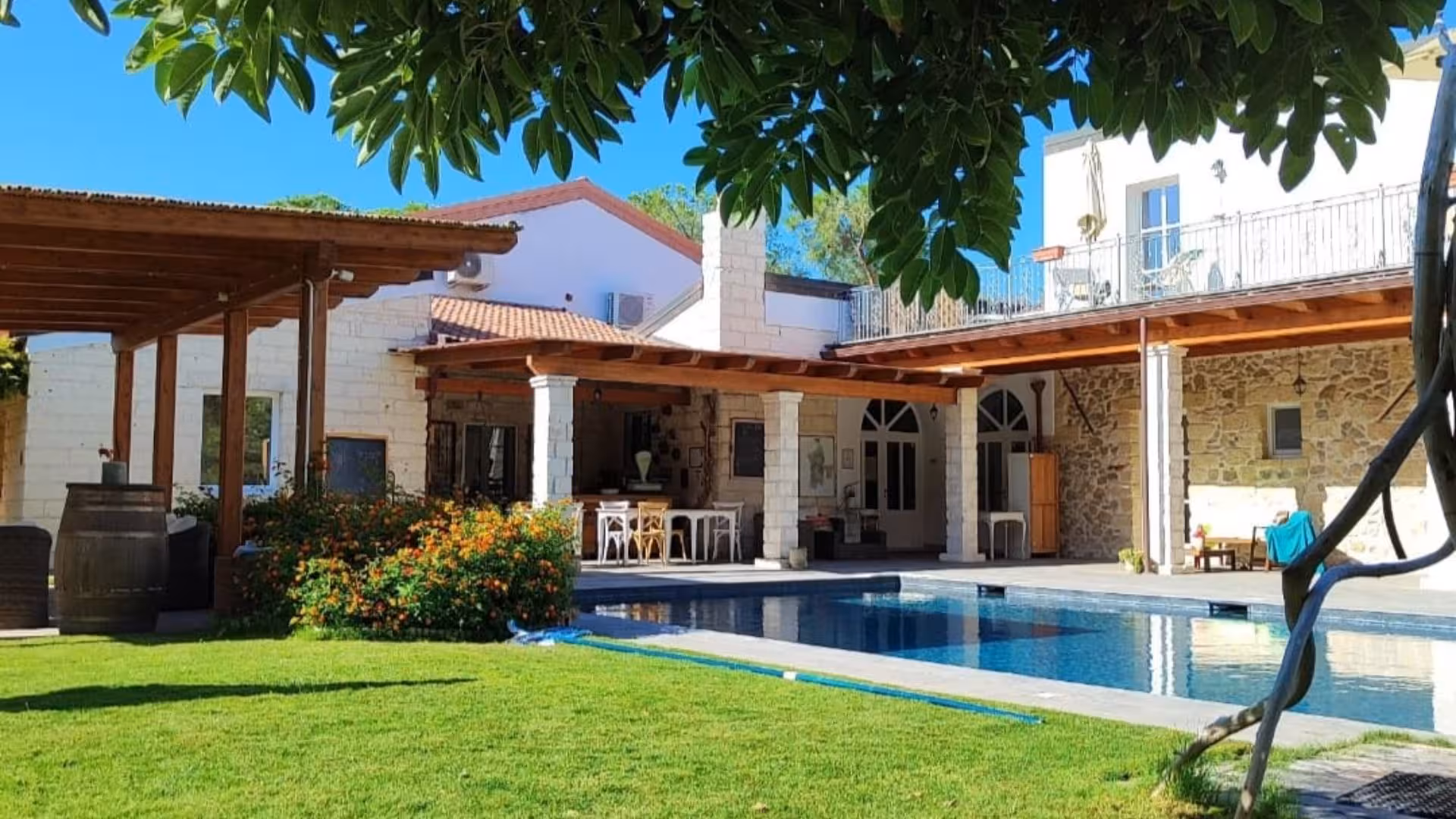 Charming villa with pool and outdoor sitting area at Sorso, perfect for a tranquil getaway.