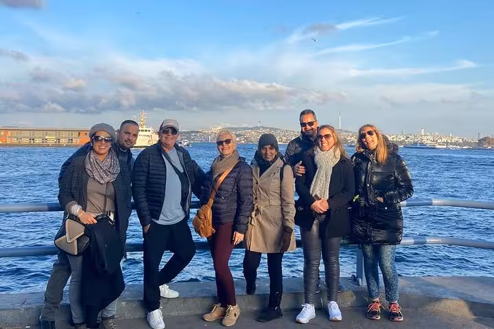 Spanish tour group photo by the Bosphorus in Istanbul, waterfront sightseeing on 6-day Istanbul Cappadocia tour with flights
