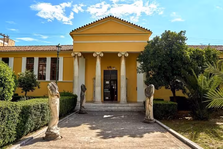 Neoclassical Sparta museum with statues and columns, cultural stop on 2-day Mystras Sparta Monemvasia tour