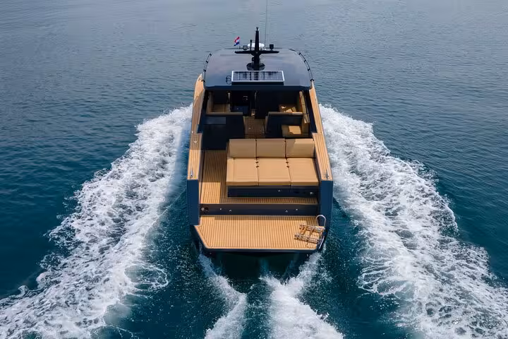 Rear view of modern speedboat leaving wake on Blue Cave, Vis, Hvar and Pakleni Islands group tour
